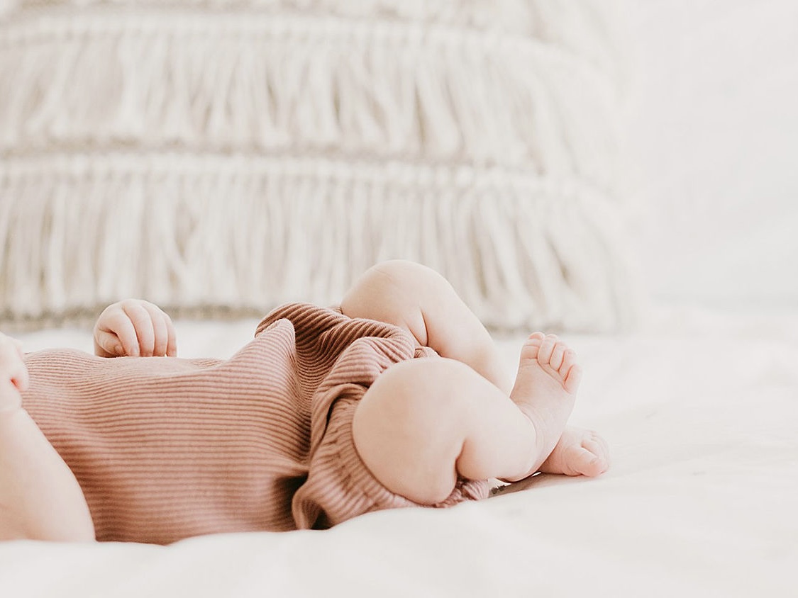 stay at home mom creating digital product ideas during nap time for her baby